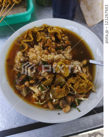 A bowl of Bubur Ayam, a comforting Indonesian chicken porridge. 121267683