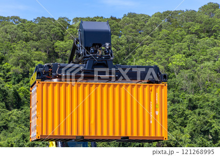 Reach stacker cargo forklift container box import export logistic transportation industrial, Reach stacker pick up container, Reach stacker container loader crane lifting maritime cargo container. 121268995