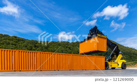 Reach stacker cargo forklift container box import export logistic transportation industrial, Reach stacker pick up container, Reach stacker container loader crane lifting maritime cargo container. 121269000