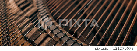 Header format top view of intricate piano strings inside classic grand piano in warm natural light, copy space Header format top view of intricate piano strings inside classic grand piano in warm natural light, copy space 121270075