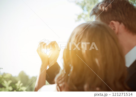Newlyweds joined hands in the shape of a heart. Sign of love and loyalty. 121271514