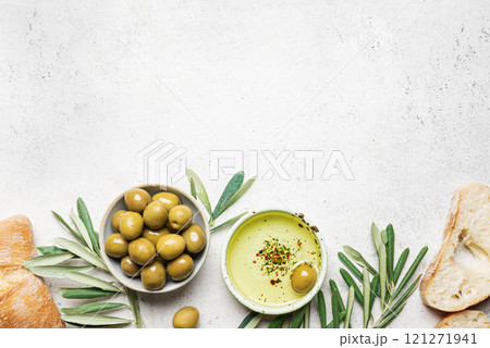 Olive oil with olives and bread 121271941