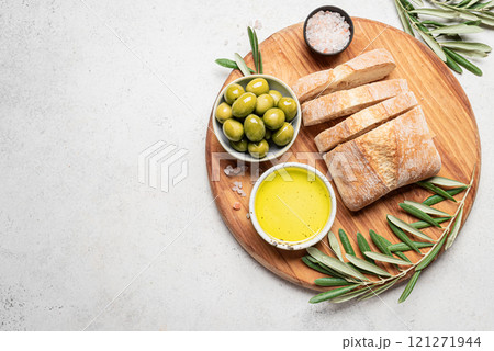 Olive oil with olives and bread Olive oil with olives and bread 121271944