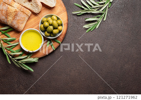 Olive oil with olives and bread 121271962