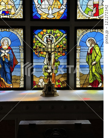 Stained Glass with Altar and Crucifix in Church Interior Stained Glass with Altar and Crucifix in Church Interior 121272342