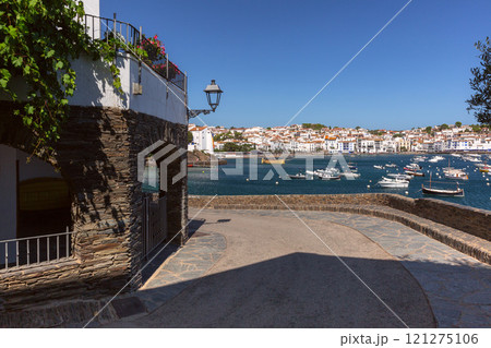 Facades of traditional white houses on the waterfront in Cadaques, Spain Facades of traditional white houses on the waterfront in Cadaques, Spain 121275106