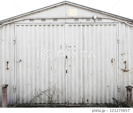 old metal door to the car garage old metal door to the car garage 121275657