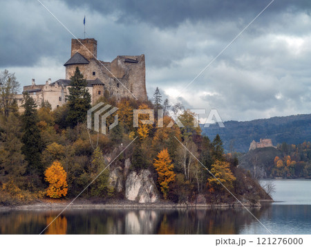 Scenic View of Niedzica Castle and Lake Czorsztyn under cloudy sky Scenic View of Niedzica Castle and Lake Czorsztyn under cloudy sky 121276000