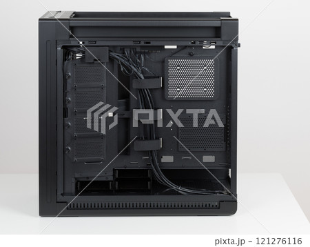 Side view of empty  big tower, PC case, chassis. Chassis supports up to four HDDs or up to eight SATA SSDs. At the bottom is a cover for power supply unit 121276116