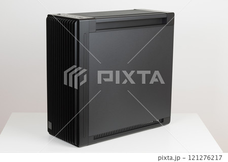 Side view of empty  big tower, PC case, chassis,  15.5 mm front panel grille with 45% porosity for maximum air intake. Studio shoot on white background. 121276217