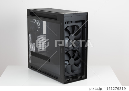 Two 200mm pre-installed system fans, front panel IR dust indicator. Side view of empty big tower, PC case, chassis. Left panel is tempered-glass. Two 200mm pre-installed system fans, front panel IR dust indicator. Side view of empty big tower, PC case, chassis. Left panel is tempered-glass. 121276219