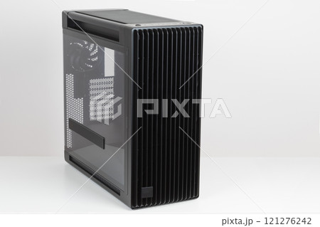Side view of empty big tower, PC case, chassis, tempered-glass left panel has a mesh window to aid in graphics-card ventilation Side view of empty big tower, PC case, chassis, tempered-glass left panel has a mesh window to aid in graphics-card ventilation 121276242