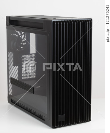 Side view of empty big tower, PC case, chassis, tempered-glass left panel has a mesh window to aid in graphics-card ventilation Side view of empty big tower, PC case, chassis, tempered-glass left panel has a mesh window to aid in graphics-card ventilation 121276243