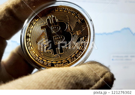Bitcoin gold metal coin in capsule. Cryptocurrency symbol Bitcoin gold metal coin in capsule. Cryptocurrency symbol 121276302