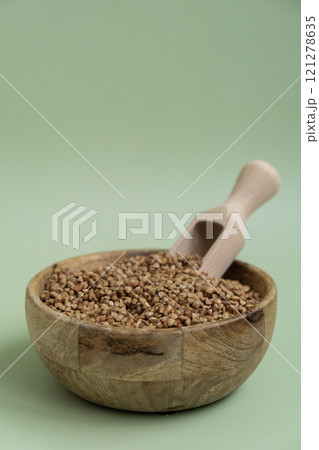 Raw buckwheat porridge Gluten free cereals. Health gut benefits. Concept of alternative whole spelt grain ingredient. Vegetarian diet recipes. Plant-based lifestyle. Copy space Protein rich Raw buckwheat porridge Gluten free cereals. Health gut benefits. Concept of alternative whole spelt grain ingredient. Vegetarian diet recipes. Plant-based lifestyle. Copy space Protein rich 121278635