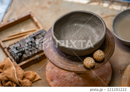 Vintage Crafting Tools for work with clay and Accessories Amidst a Rustic Table  121281222