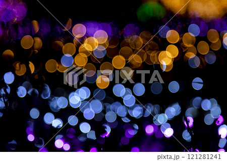 A stunning abstract background of golden, blue, and purple bokeh lights, creating vibrant and dreamy festive visual effect A stunning abstract background of golden, blue, and purple bokeh lights, creating vibrant and dreamy festive visual effect 121281241
