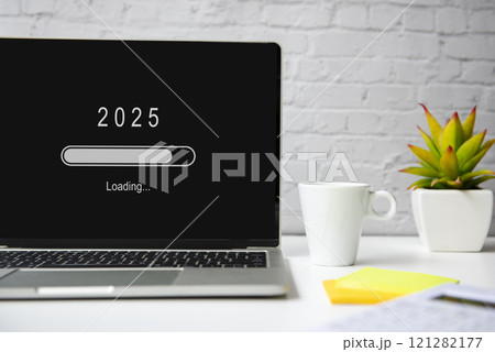 Loading year 2025 for start new business and new life. Equipment working in office with coffee drink.  121282177