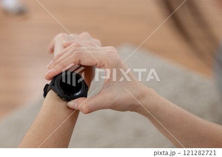 Person pointing touching at smart watch black screen display. Black space of smart wristwatch use for text electronice, Message notifications, heart rate measurement during exercise. Person pointing touching at smart watch black screen display. Black space of smart wristwatch use for text electronice, Message notifications, heart rate measurement during exercise. 121282721