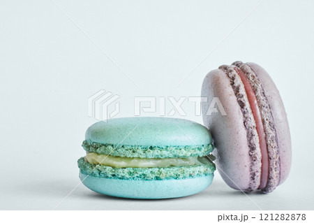 Two colorful French Macarons, macaroons cakes with different flavors Two colorful French Macarons, macaroons cakes with different flavors 121282878