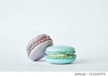 Two colorful French Macarons, macaroons cakes with different flavors Two colorful French Macarons, macaroons cakes with different flavors 121282879