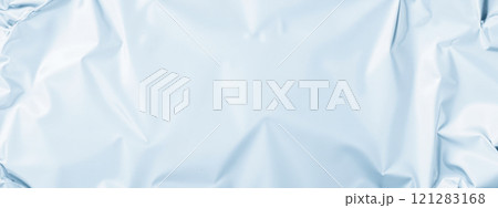Crumpled light blue foil texture background, smooth metallic surface, soft reflective design, shiny wrinkled pattern, elegant material for modern creative visual 121283168