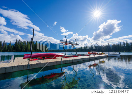 Canoe racks on dock at Beauvert Lake (Lac Beauvert). Jasper National Park summer landscape. Alberta, Canada. 121284477