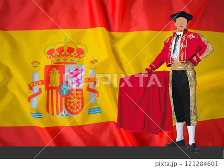 Spanish bullfighter posing with traditional outfit holding red cape in front of flag 121284601
