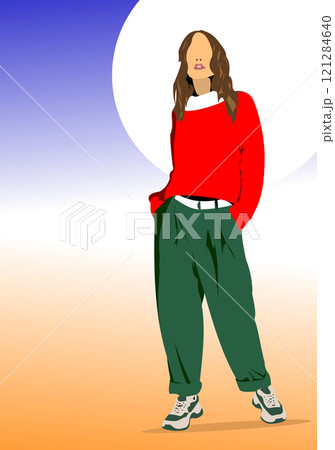 Fashionable woman is standing with her hands in her pockets, showcasing a trendy and stylish outfit 121284640