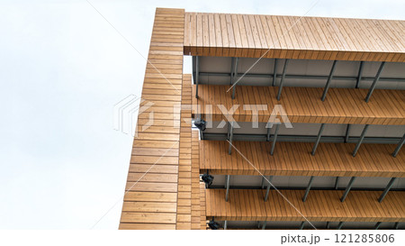Wooden architectural structure of street stage under a cloudy blue sky Wooden architectural structure of street stage under a cloudy blue sky 121285806