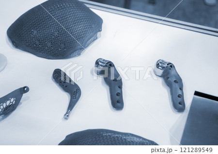 Implants and prostheses printed on 3D printer from biocompatible titanium powder. Cranioplasty for human skull, jaw fixation plates. . Endoprostheses. Bioengineering Implants and prostheses printed on 3D printer from biocompatible titanium powder. Cranioplasty for human skull, jaw fixation plates. . Endoprostheses. Bioengineering 121289549