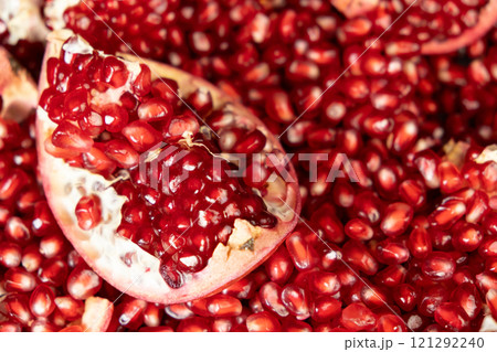Pomegranate background, lots of peeled pomegranates and seeds Pomegranate background, lots of peeled pomegranates and seeds 121292240