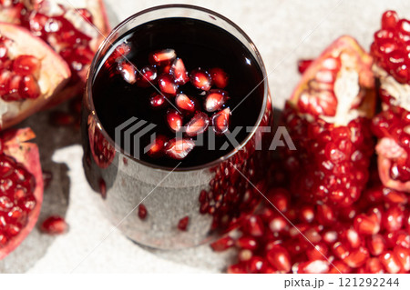 Natural organic pomegranate juice is garnished with pomegranate seeds Natural organic pomegranate juice is garnished with pomegranate seeds 121292244