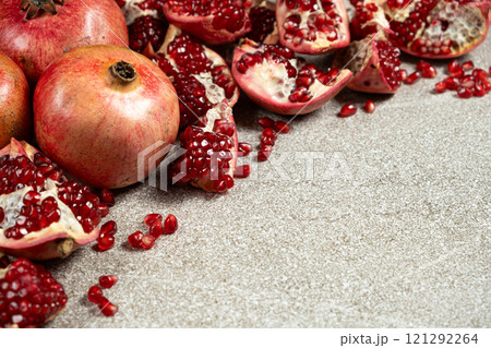 Ripe pomegranates, peeled and whole, place for text Ripe pomegranates, peeled and whole, place for text 121292264