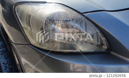 some fine mist inside head light of car 121292656