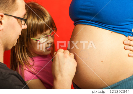 Pregnant woman belly, father drawing on stomach 121292844