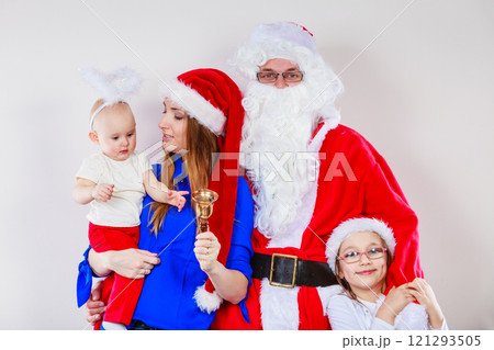 Mother, Santa and two daughters christmas family photo 121293505