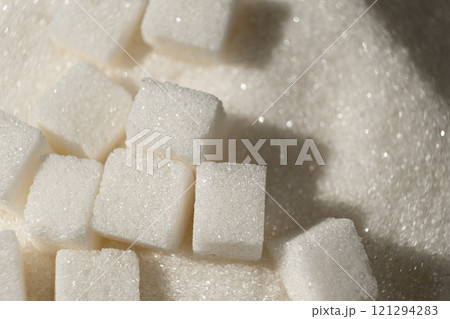 White refined beet sugar in the form of crystals and cubes. White refined beet sugar in the form of crystals and cubes. 121294283