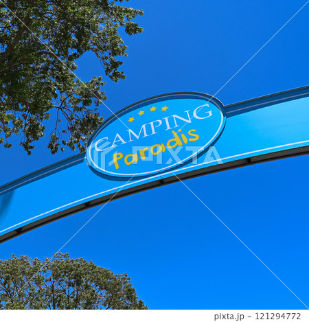 Camping Paradis sign, four stars against a blue sky in Port Grimaud Camping Paradis sign, four stars against a blue sky in Port Grimaud 121294772