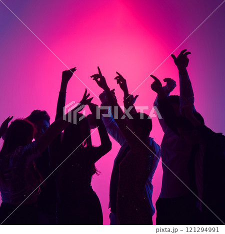 Cheers erupt as friends toast under glowing lights, energy of music fueling night filled with dancing, joy, and shared memories. Cheers erupt as friends toast under glowing lights, energy of music fueling night filled with dancing, joy, and shared memories. 121294991