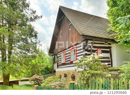 Traditional wooden cottage in Czech republic Traditional wooden cottage in Czech republic 121295680