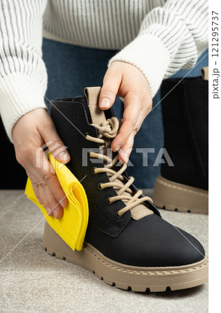 Shoe Care, Woman Wiping Cloth Surface Of Leather Shoe. Shoe Care, Woman Wiping Cloth Surface Of Leather Shoe. 121295737