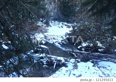 canal with snow at Four Girls Mountain or Siguniangshan as know as Switzerland travel location of China with sky background 121295813