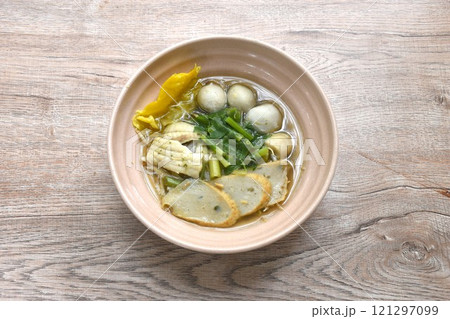 boiled dory fish and fishball with bean sprout topping crispy dumpling in soup on bowl boiled dory fish and fishball with bean sprout topping crispy dumpling in soup on bowl 121297099