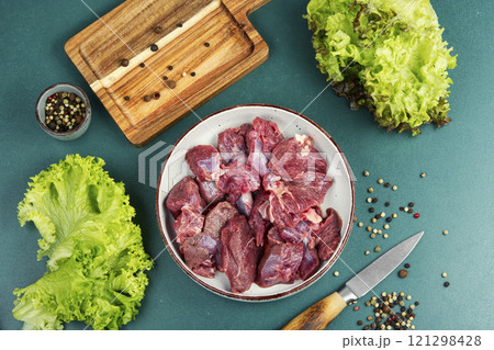 Raw deer venison prepared for a cooking process. 121298428