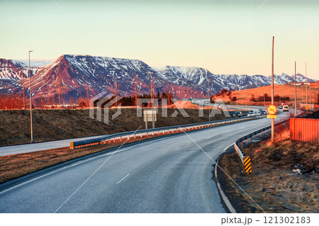 Road trip on winding road and volcanic mountain in the evening 121302183
