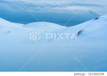 Snowy hill of summit on frozen glacier wilderness in Iceland Snowy hill of summit on frozen glacier wilderness in Iceland 121302194
