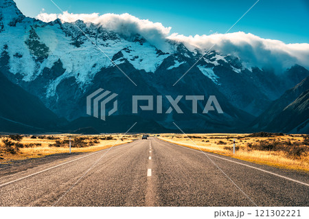 Road trip leading to Mount Cook amidst grassland in national park during autumn at New Zealand 121302221