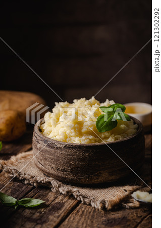 Mashed potatoes in bowl 121302292