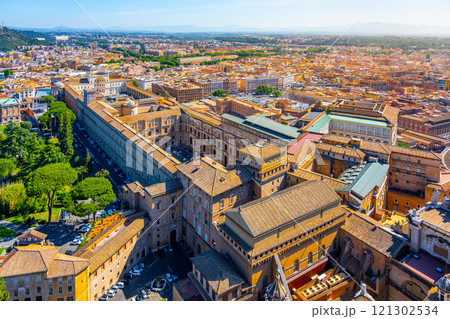 The stunning aerial perspective captures the expansive Vatican Museums and the lush gardens, showcasing the intricate architecture and vibrant greenery of this historic site in Rome. The stunning aerial perspective captures the expansive Vatican Museums and the lush gardens, showcasing the intricate architecture and vibrant greenery of this historic site in Rome. 121302534